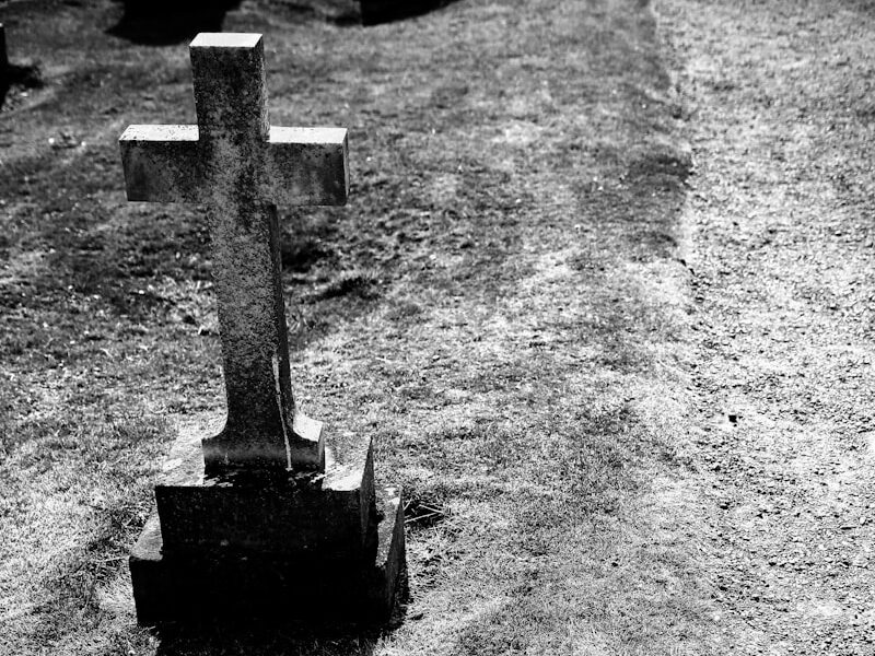 grayscale photography of gray tombstone