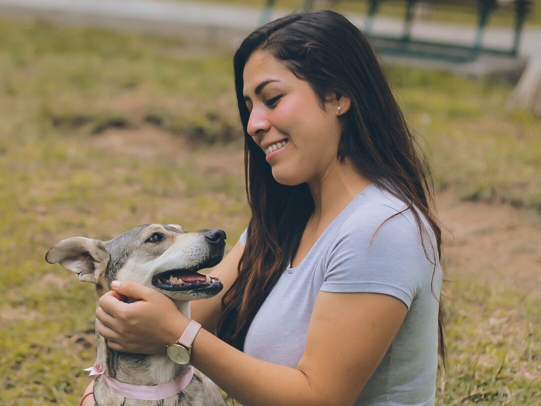 woman petting dog