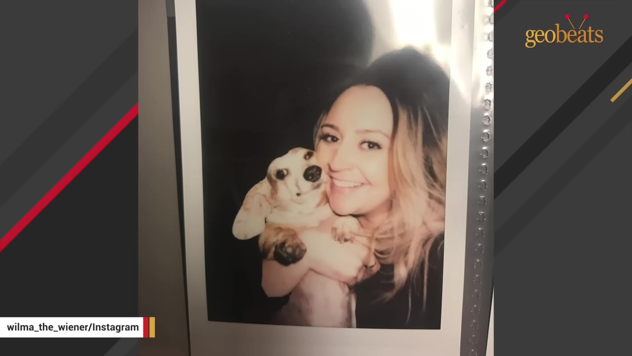 A polaroid-style photograph of a smiling woman holding a small dachshund puppy close to her cheek.