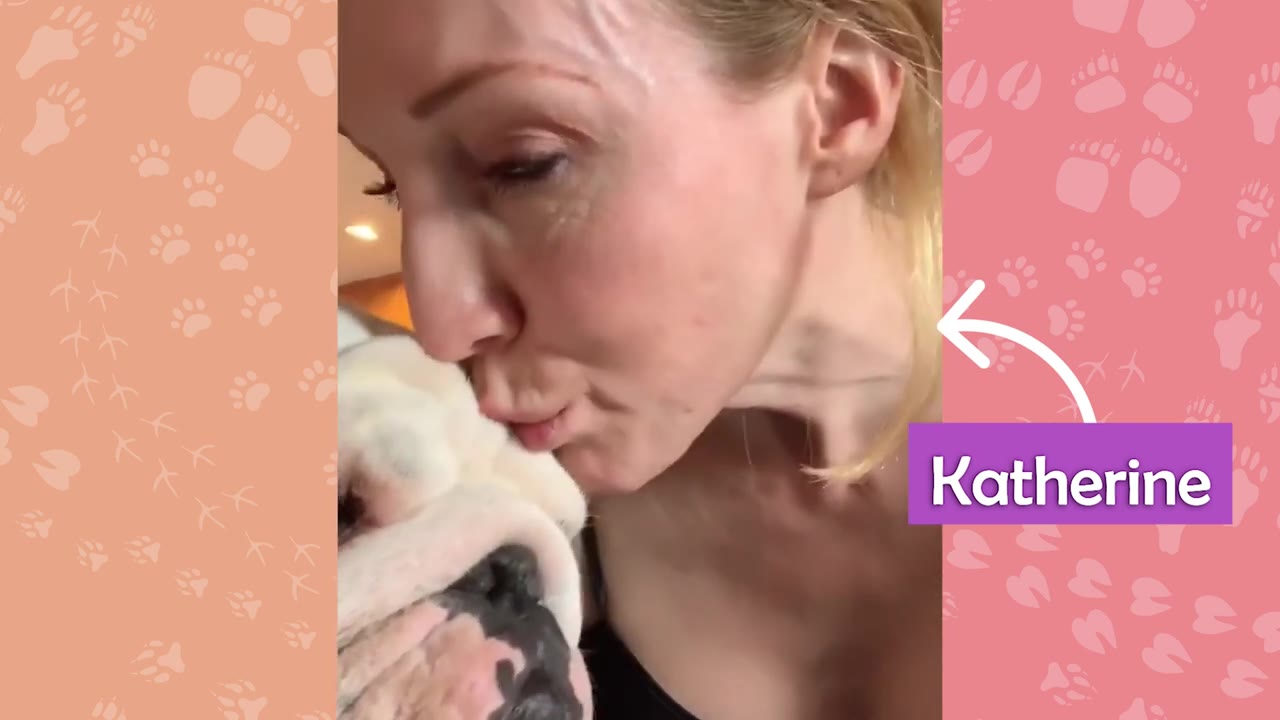 A close-up of a woman named Katherine kissing a white bulldog on the head.