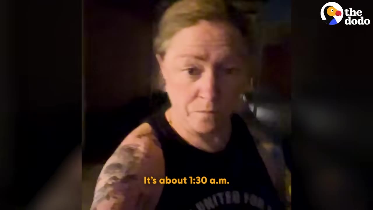A woman with tattoos on her arms looks directly at the camera at night, with a subtitle reading 'It's about 1:30 a.m.'
