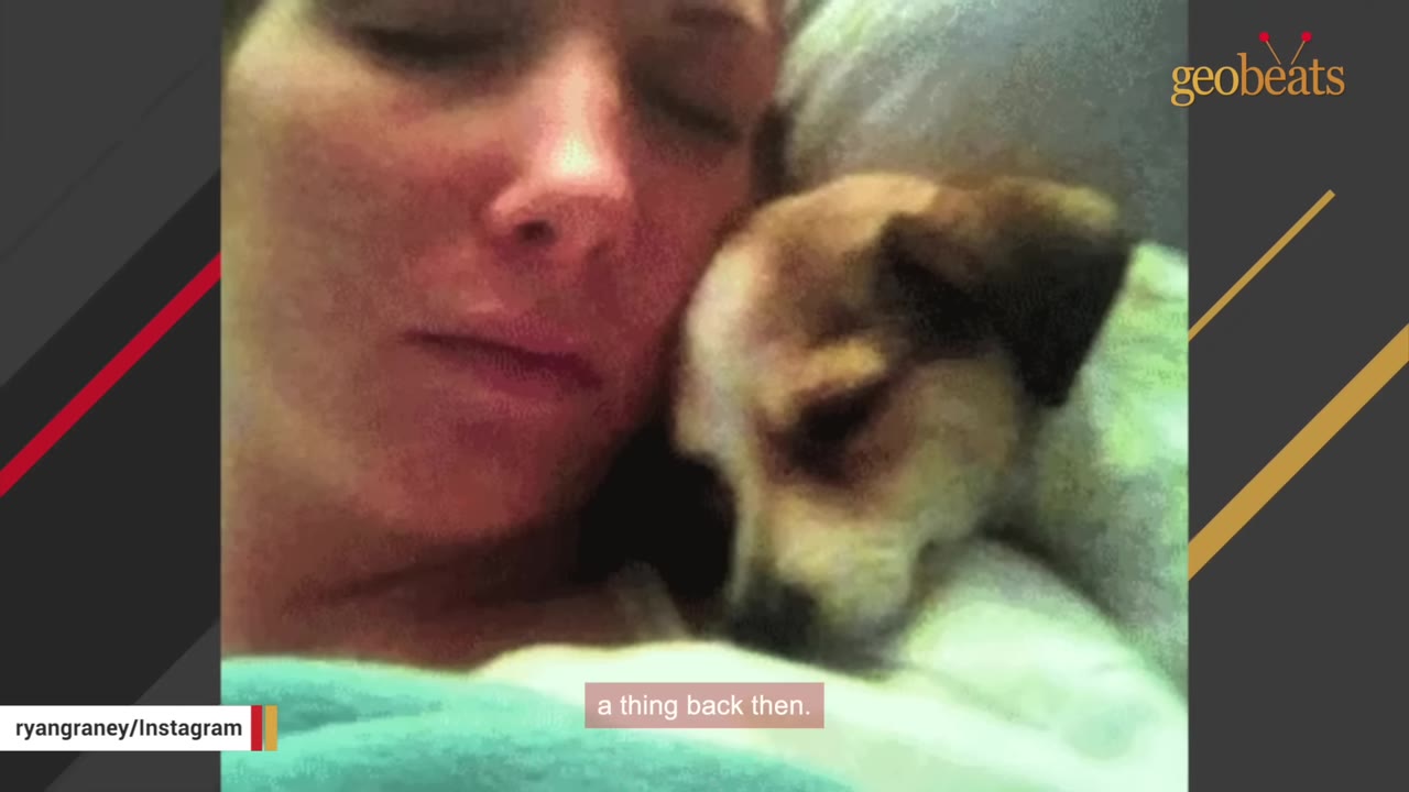 A close-up photograph of a woman sleeping with her face next to a small puppy.