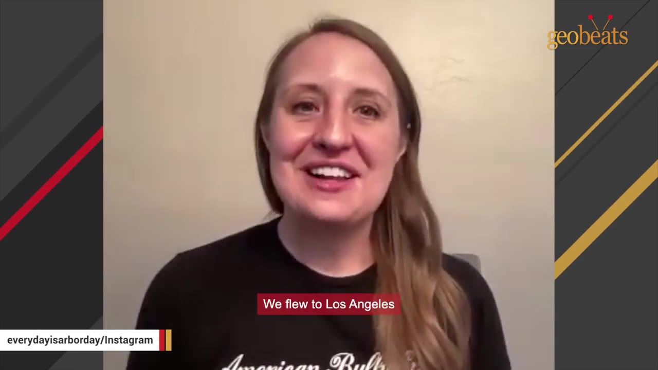 A woman with long brown hair smiling and talking to the camera, with a subtitle that reads 'We flew to Los Angeles'.