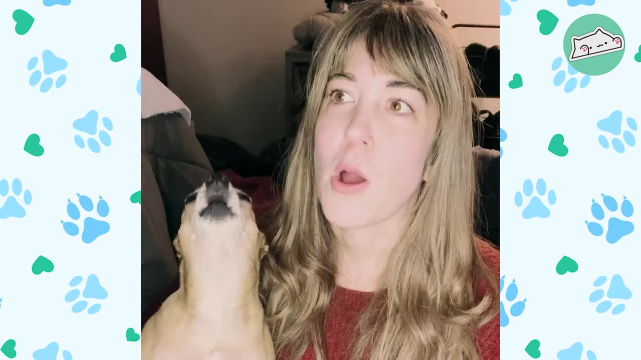 A small tan dog tilts its head back to howl next to a woman with blonde hair who has an open-mouthed, surprised expression.