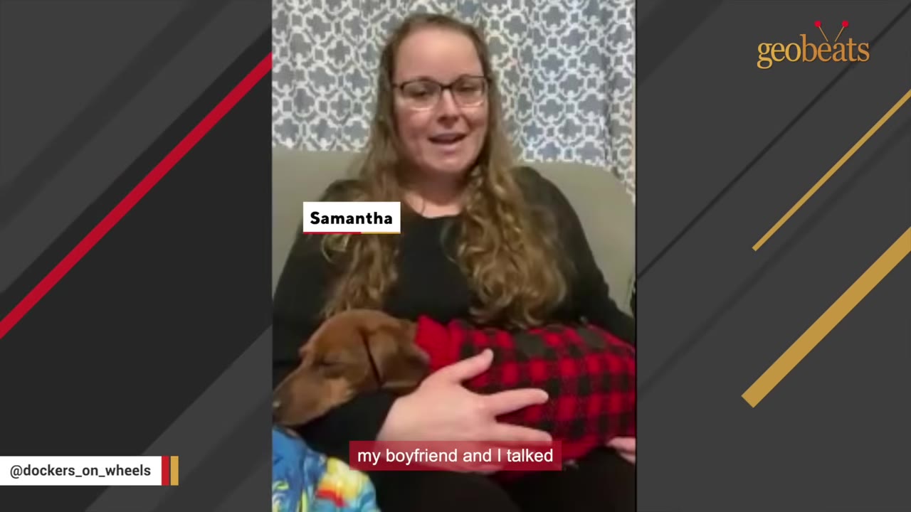 A woman named Samantha smiling while holding a brown dachshund wearing a red and black plaid sweater in her lap.
