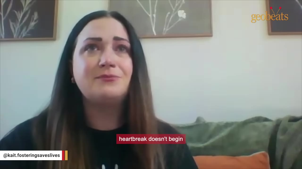 A close-up of a woman with long dark hair looking tearful and emotional, with a subtitle that reads 'heartbreak doesn't begin'.