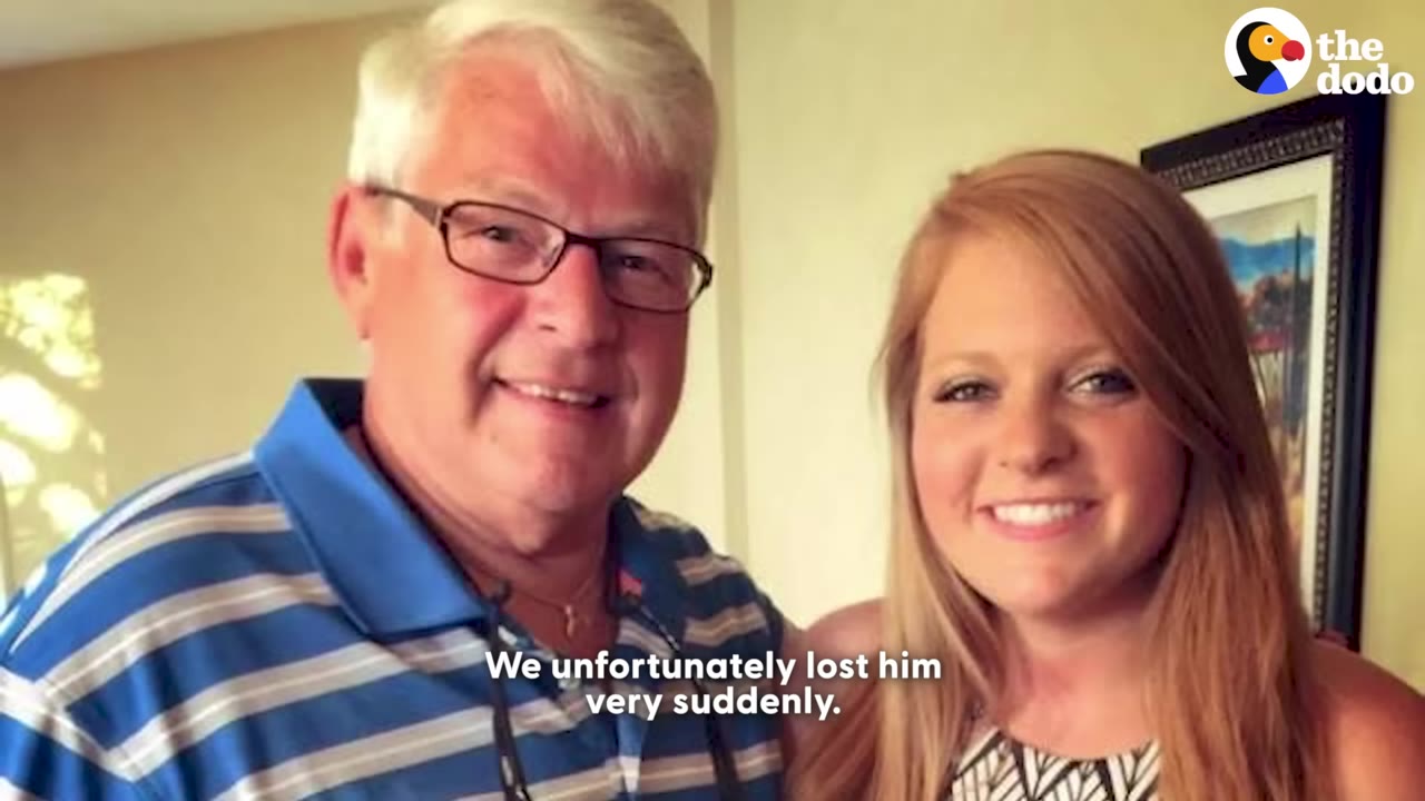 A smiling older man with glasses and a blue striped polo shirt stands next to a smiling young woman with long reddish-blonde hair.