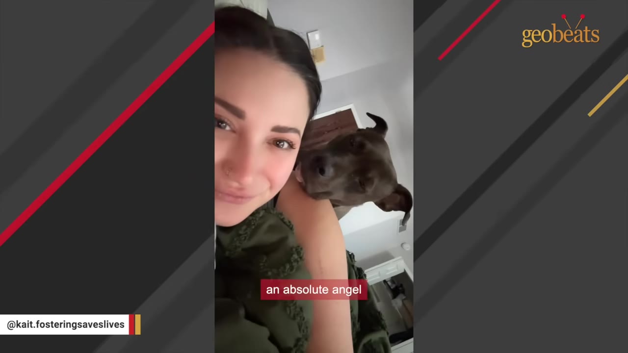 A close-up selfie of a smiling young woman with a brown dog resting its head affectionately on her shoulder.