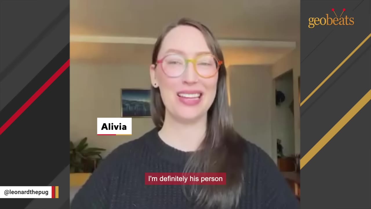 A woman named Alivia wearing colorful glasses and a black sweater smiles warmly during an interview.