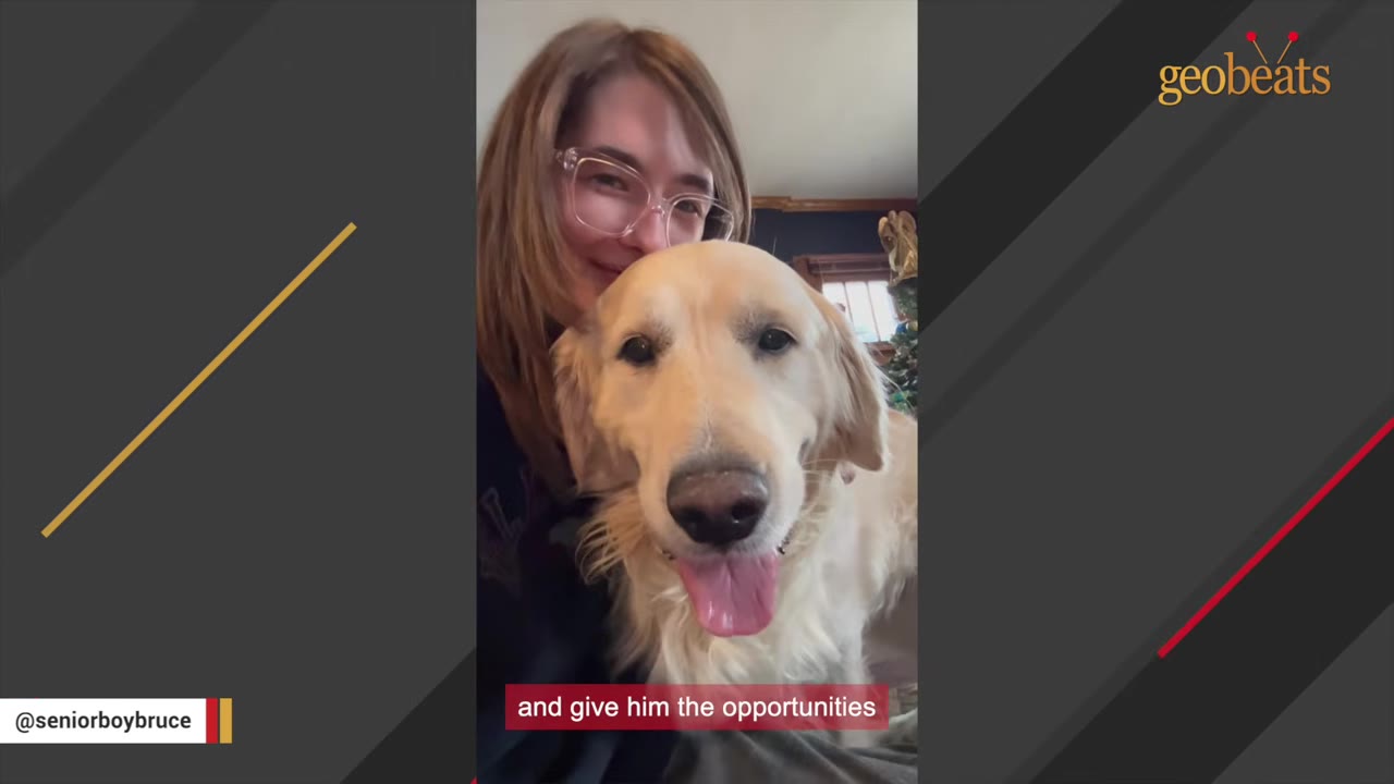 A smiling woman with glasses poses next to a happy golden retriever dog with its tongue out.
